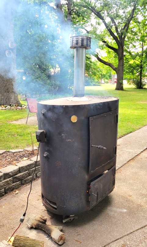 Custom-built steel barrel smoker fabricated by Lutz Welding & Fabrication